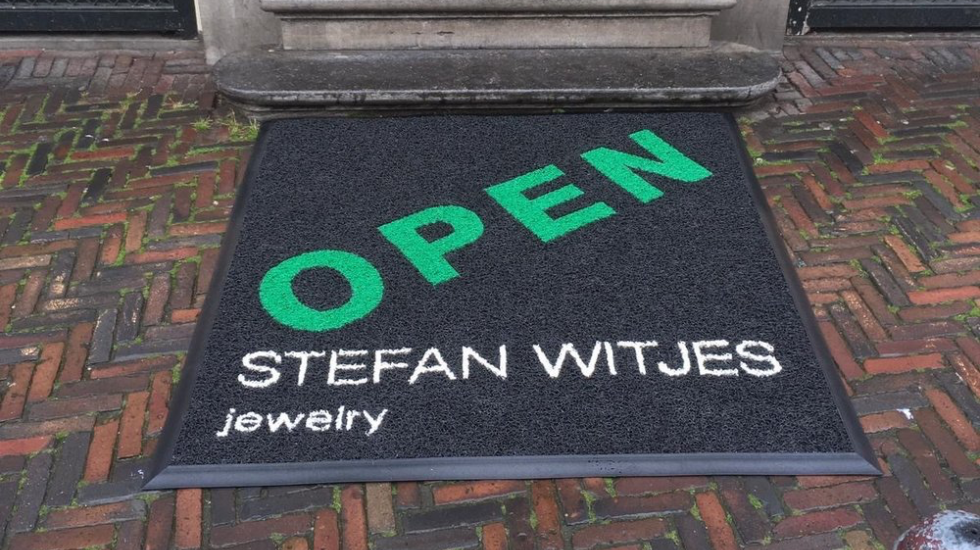 Spaghetti entreemat met logo en huisstijlkleuren van Nonhebel